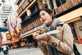 Lady traveler enjoy eating takoyaki Royalty Free Stock Photo