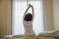 Lady wake up stretch oneself lazily for fresh morning Royalty Free Stock Photo