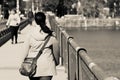 Lady walking on the massachussets ave bridge