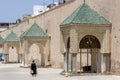 A lady walks through the beautiful Lahdim Square in Meknes in Morocco.