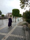 A lady walks in the rain for shopping Royalty Free Stock Photo