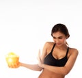 The lady is wearing black sport bra,hold potato chips bowl in hand and push it out from body,reject unhealthy food,wiht unhappy fa Royalty Free Stock Photo