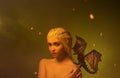 Lady with white braided hair and little dragon bare shoulder.