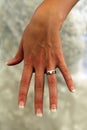 Lady in white revealing wedding ring