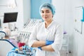 Woman dental surgeon crossing arms in clinic Royalty Free Stock Photo