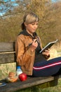 Lady Writing Outdoors Royalty Free Stock Photo