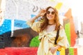 Lady in yellow summer costume standing on colorful background Royalty Free Stock Photo