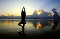 Lady yoga figure with sunset scene