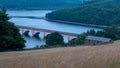 Ladybower Reservoir, Peak District UK: Car crossing the viaduct Royalty Free Stock Photo