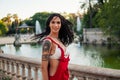 Ladyboy tattooed transgender model is dancing in the green park Royalty Free Stock Photo