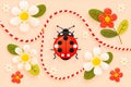 Ladybug with flowers and red and white rope on light background. Hello spring, 1 march