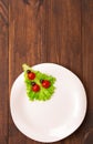 Ladybug made of raw tomato on lettuce leaf Royalty Free Stock Photo