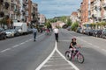 Laeken, Brussels Capital Region - Belgium - Young migrant children driving the bicycle at the Bockstael Avenue during the Car Free