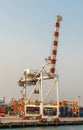 Tall red and white non-working container crane at Laem Chabang Thailand