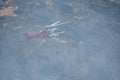 A LAFD Augusta Westland 139 helicopter makes a water drop on a brush fire in Chatsworth, CA