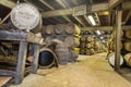 Lafroaig old wooden barrels and casks in cellar at whisky distillery in Scotland Royalty Free Stock Photo