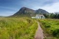 Lagangarbh wee white Hut in mid summer with blue sky, Glencoe, Scotland Royalty Free Stock Photo
