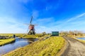 Lagenwaardse historic smock mill in Dutch polder landscape