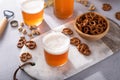 Lager beer in glasses with variety of snacks