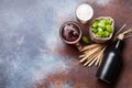 Lager beer mug, bottle, hops and wheat on old stone table Royalty Free Stock Photo