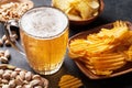 Lager beer and snacks on stone table Royalty Free Stock Photo