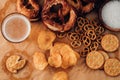 Lager beer and snacks on table. Nuts, chips, pretzel. Top view with copy space Royalty Free Stock Photo