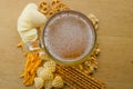 Lager beer and snacks on table. Nuts, chips, pretzel. Royalty Free Stock Photo