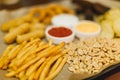 Lager beer and snacks on wooden table. Nuts, chips, peanut, toast, crackers. Appetizer fast food. Craft beer. Beerboard Royalty Free Stock Photo