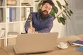 Lagging system. Hate office routine. Man bearded crush computer. Software license agreement. Destroy laptop. Hateful job Royalty Free Stock Photo