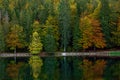 Lower lake of Laghi di Fusine in Autumn colours in Italy