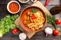 Lagman soup from middle Asia on dark wooden background