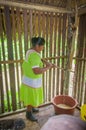 LAGO AGRIO, ECUADOR - NOVEMBER, 17 2016: Woman demonstrates cooking yucca tortillas in an indoors in a Siona village in