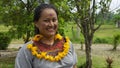 Woman of the Cofan ethnic group smiling in traditional clothing in the Cofan Dureno millennium community located on the edge of