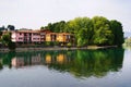 The left bank of Oglio river and a part of Paratico town, seen from the bridge who connect the cities Sarnico and Paratico. Royalty Free Stock Photo