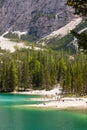 Lago Di Braies, Italy - June 1, 2018: View on the crystal clear lake with people on beach