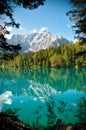 Lago di Fusine e monte Mangart with woods frame Royalty Free Stock Photo