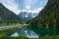 Lago di Landro with reflections of the mountains in the water, Italy