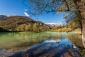 Lago di Tenno - Small lake with island in Italian Alps Trentino Italy Royalty Free Stock Photo