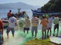 Lagoa da ConceiÃÂ§ÃÂ£o, Florianopolis Sant catarina Brazil/11th June 2011/ Local fishermen and bystanders help with sorting a catch