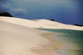 Lagoon of crystal blue waters surrounded by white sand dunes Royalty Free Stock Photo