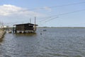 Lagoon water and stilt fishing hut, Comacchio, Italy Royalty Free Stock Photo