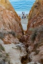 Lagos, Algarve PORTUGAL - 16 August 2019 - Arriba with winding cliff with sand and people with kayaks in background