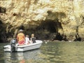 Lagos, Faro / Portugal; 09 27 2014: couple starting a visit of the rocky coast by motor boat