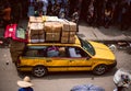 A fully loaded yellow Lagos taxi