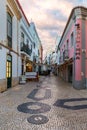 Lagos, Portugal - June 10, 2018: Street in the old town in the center of Lagos, Algarve region, Portugal. Narrow street in Lagos,