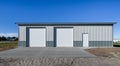 Lagre standing separately, newly built garage in suburb area, USA. Concrete apron, driveway