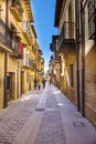 Laguardia, Alava, Spain. March 30, 2018: Calle lamada Mayor with cobblestone floor and large stone slabs, with facades of stone ho