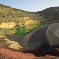 Laguna de Los Clicos on the coast of Lanzarote with its green lagoon inside the crater of the volcano
