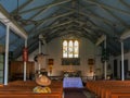 LAHAINA, UNITED STATES OF AMERICA - JANUARY 7, 2015: worshiper sits in a pew in the interior of the holy innocents church in