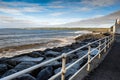 Lahinch town coast line. County Clare, Ireland, Sunny day, blue cloudy sky. Nobody. Powerful waves moving towards the beach Royalty Free Stock Photo